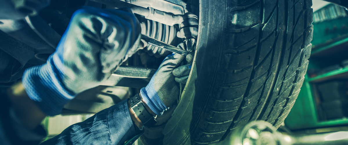 Tyre technician tightening track rod end after fitting Tyres Online Uttoxeter